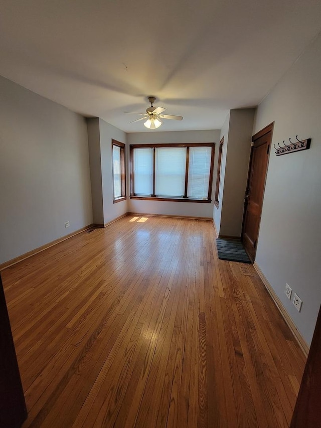 spare room with ceiling fan and light hardwood / wood-style flooring