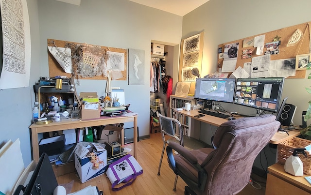 office area with light hardwood / wood-style floors