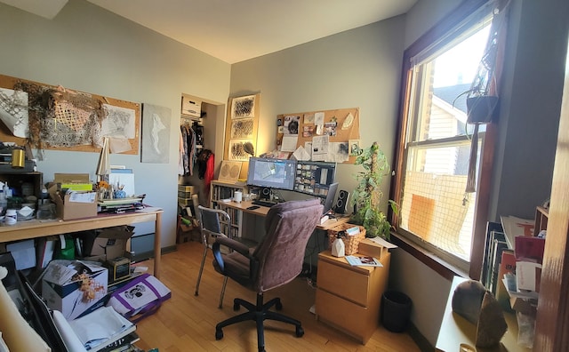 office space with light hardwood / wood-style flooring