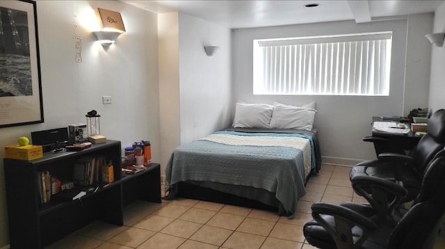 bedroom with light tile patterned flooring