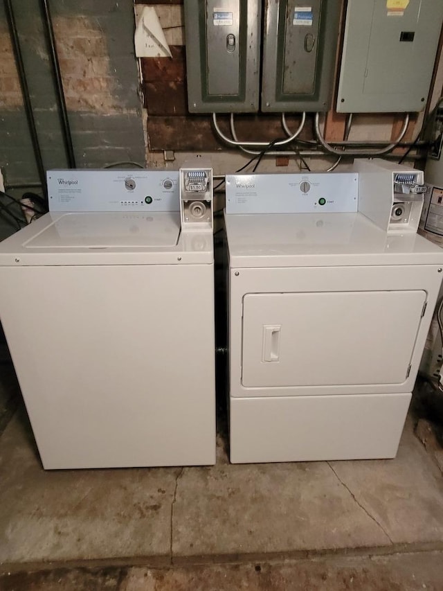 clothes washing area featuring independent washer and dryer and electric panel