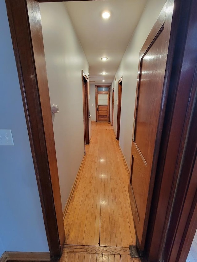 corridor featuring light wood-type flooring