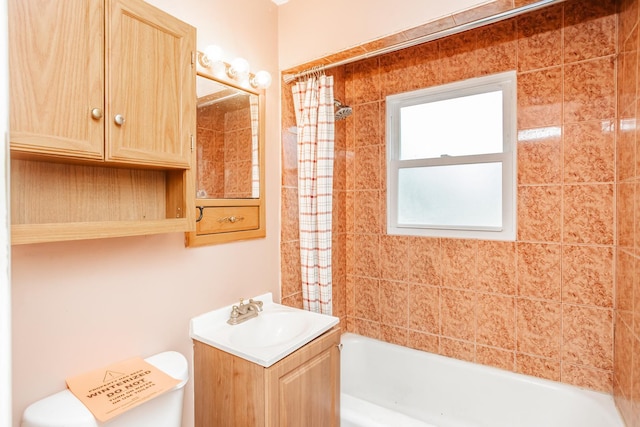 full bathroom featuring vanity, toilet, and shower / bath combo