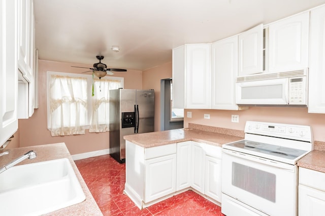 kitchen featuring white cabinetry, white appliances, and sink