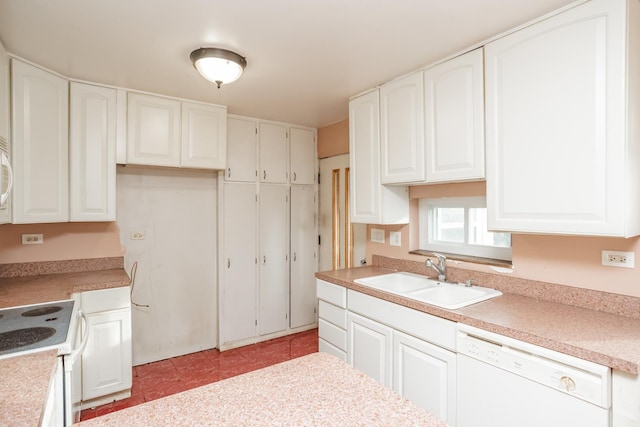 kitchen featuring sink, white cabinets, white appliances, and light tile patterned floors