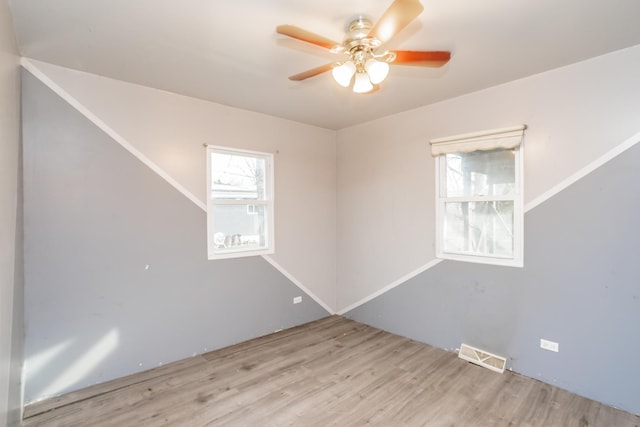 unfurnished room featuring ceiling fan and light hardwood / wood-style flooring