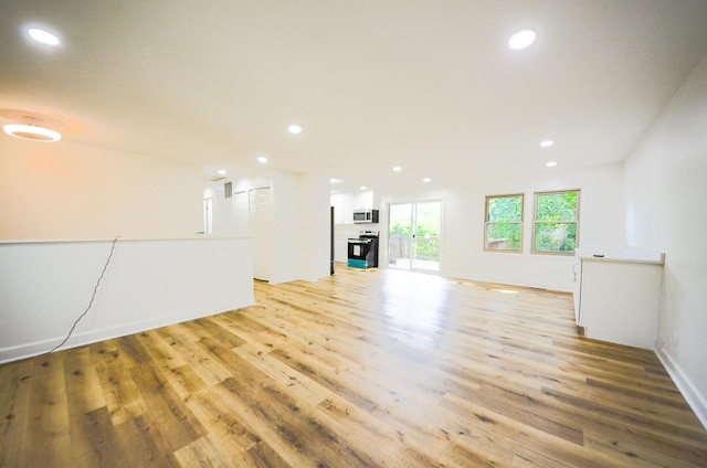 unfurnished living room with light hardwood / wood-style flooring