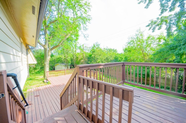 wooden deck featuring a storage unit