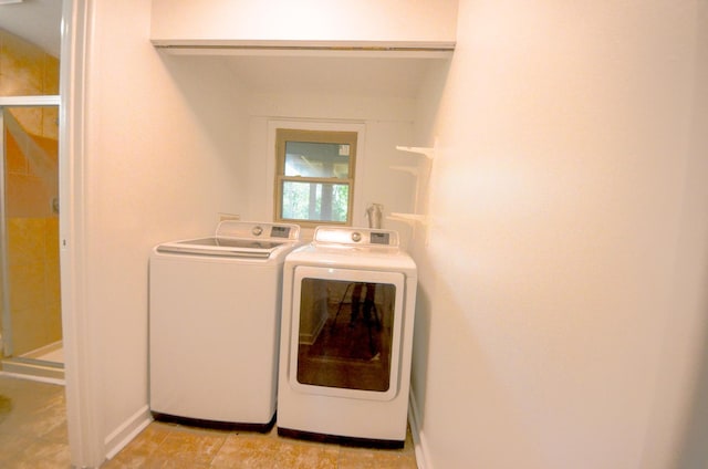 washroom featuring independent washer and dryer