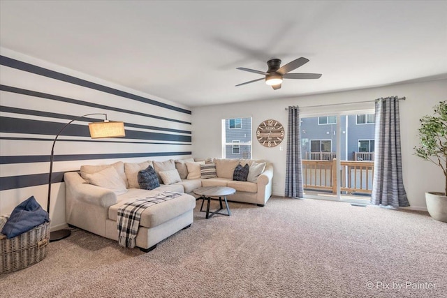 carpeted living room featuring ceiling fan