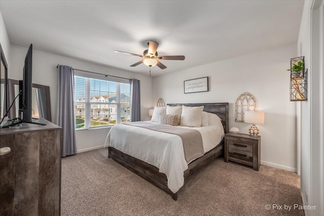 bedroom featuring light colored carpet and ceiling fan