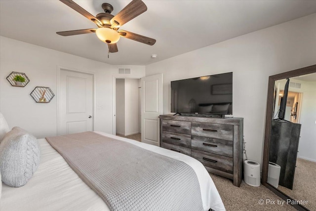 bedroom featuring ceiling fan and carpet