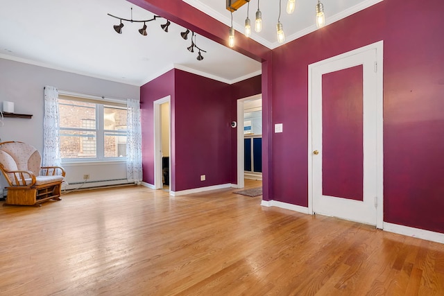 interior space with hardwood / wood-style floors and crown molding