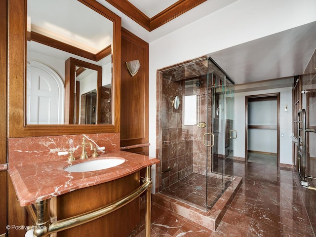 bathroom with vanity, walk in shower, and ornamental molding