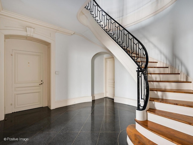 staircase with a high ceiling