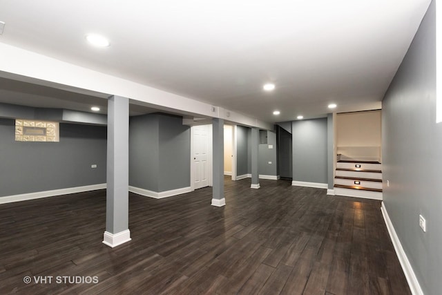 basement featuring dark hardwood / wood-style flooring