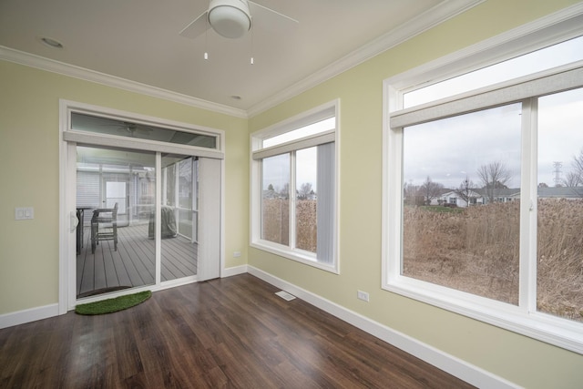 unfurnished sunroom with ceiling fan