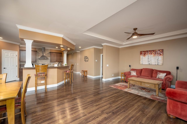 living room featuring ceiling fan, dark hardwood / wood-style flooring, and ornamental molding