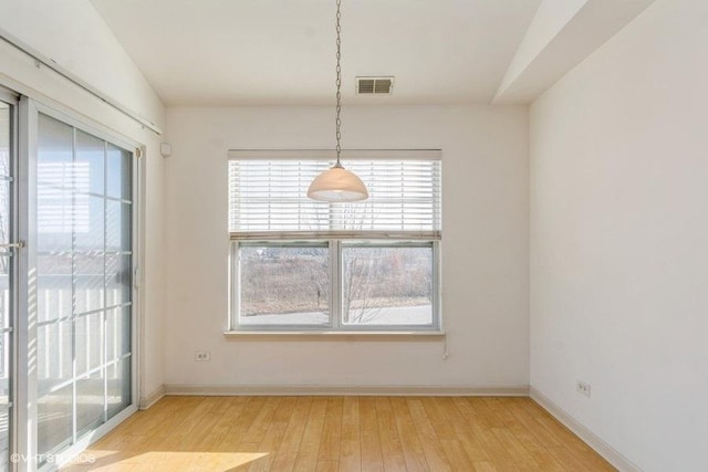 unfurnished dining area with light hardwood / wood-style flooring