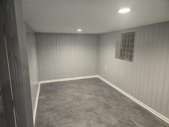 empty room with wood walls