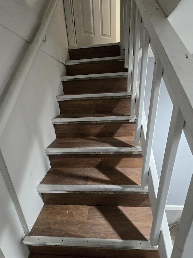 stairway featuring hardwood / wood-style flooring