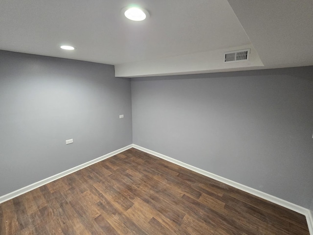 basement featuring dark wood-type flooring