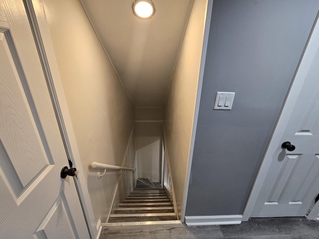 stairs featuring hardwood / wood-style floors