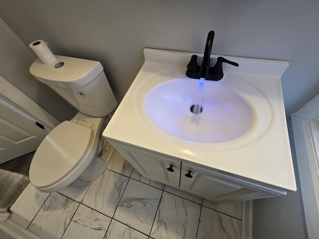 bathroom with vanity and toilet