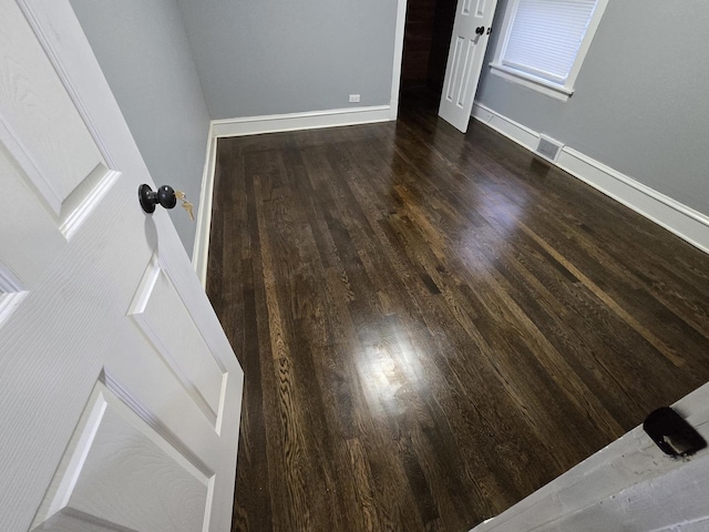 interior space with dark hardwood / wood-style flooring