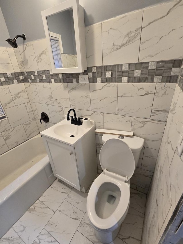 full bathroom featuring vanity, toilet, shower / bath combination, and tile walls