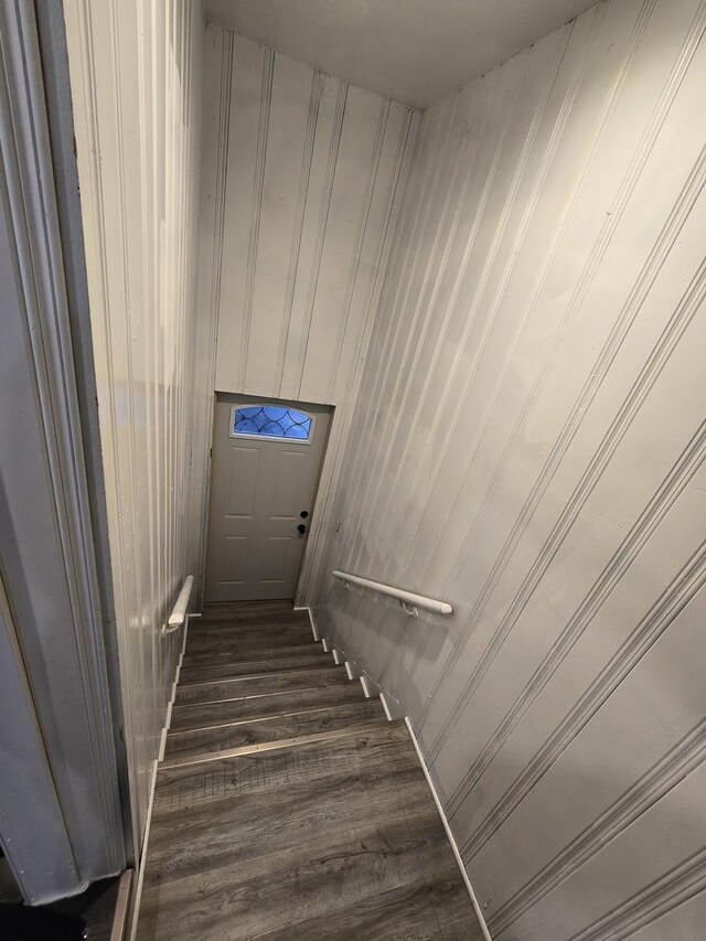 staircase featuring hardwood / wood-style floors