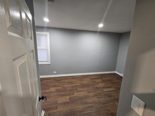 spare room featuring dark hardwood / wood-style floors