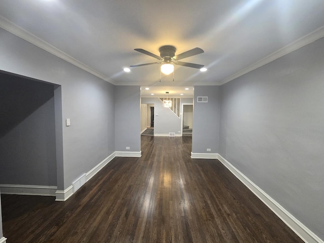 unfurnished room with ceiling fan, dark hardwood / wood-style flooring, and ornamental molding