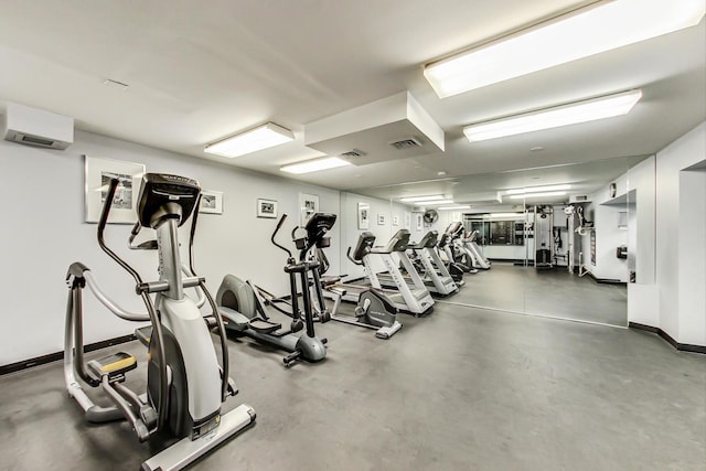 exercise room featuring baseboards and visible vents