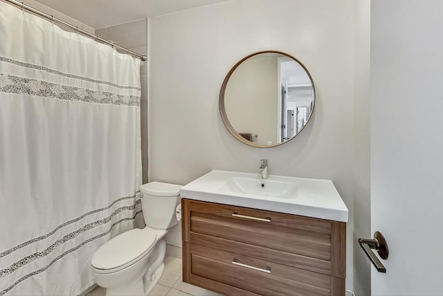 bathroom with a shower with curtain, toilet, vanity, and tile patterned flooring