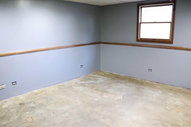 empty room with concrete flooring