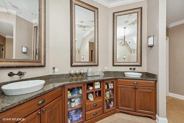 bathroom featuring tile patterned floors, vanity, crown molding, and a notable chandelier