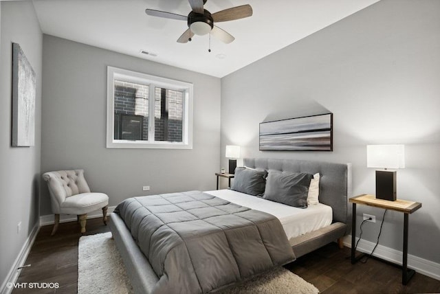 bedroom featuring ceiling fan and dark hardwood / wood-style flooring