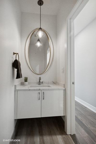 bathroom featuring wood-type flooring and vanity