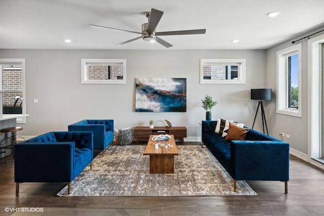 living room featuring hardwood / wood-style flooring and ceiling fan