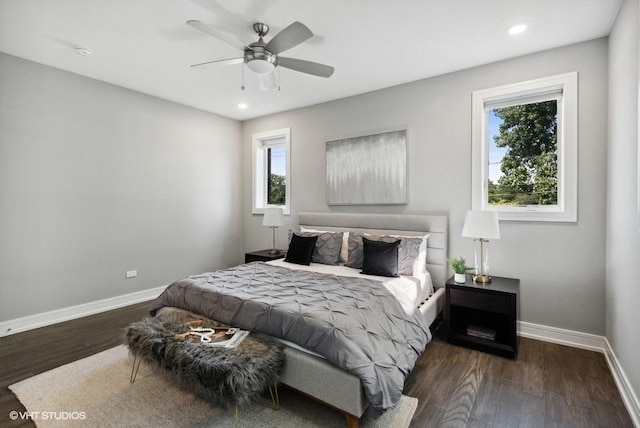 bedroom featuring ceiling fan and dark wood-type flooring