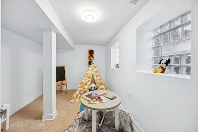 game room with light tile patterned floors