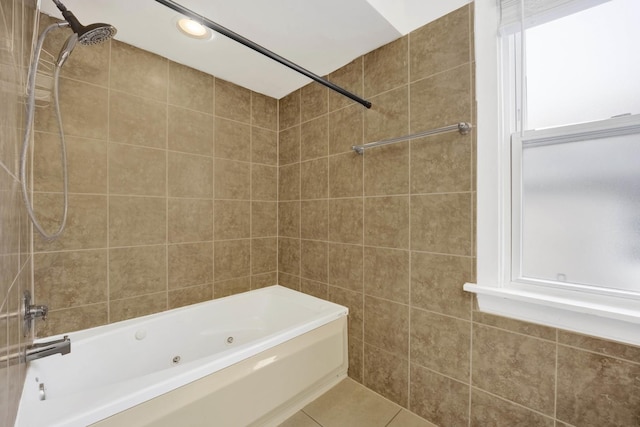 bathroom featuring tile patterned flooring and tiled shower / bath combo