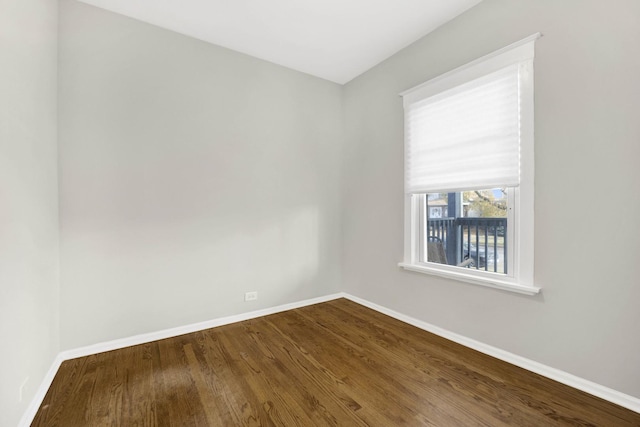 empty room featuring dark hardwood / wood-style floors