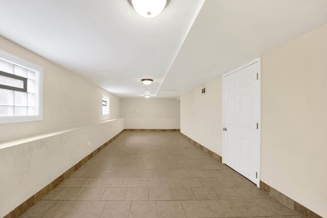 basement with light tile patterned floors