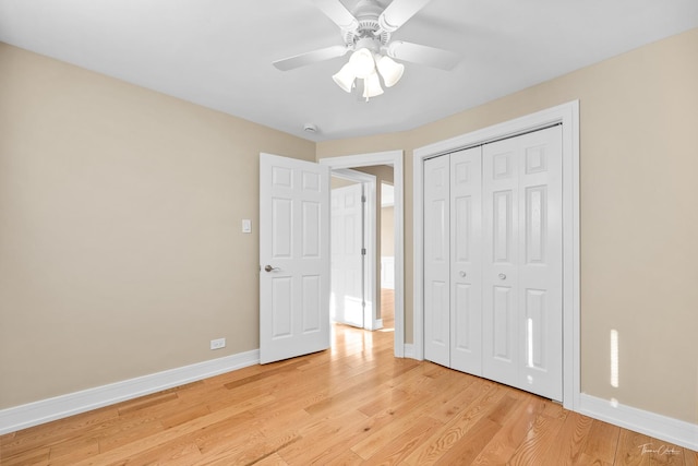 unfurnished bedroom featuring a closet, ceiling fan, and light hardwood / wood-style flooring