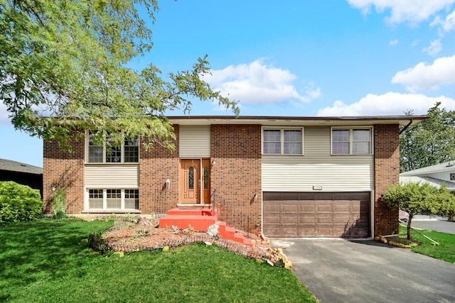 bi-level home with a garage and a front lawn