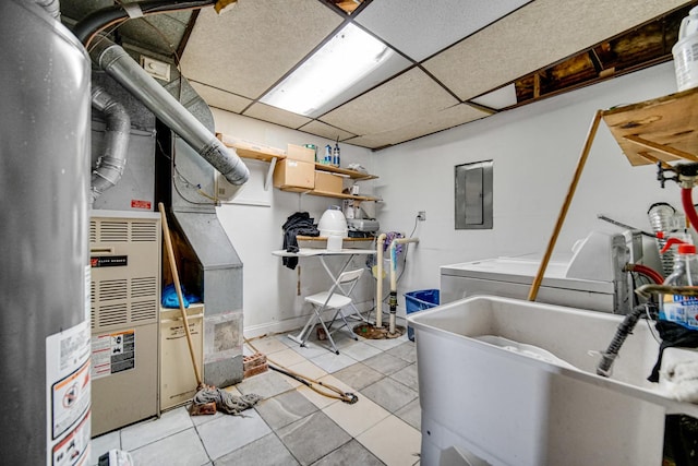 laundry room featuring heating unit, washer / clothes dryer, sink, light tile patterned floors, and electric panel