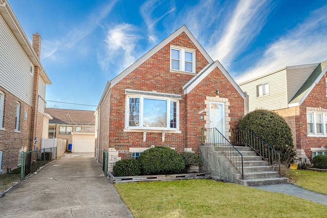 view of front of house featuring a garage, an outbuilding, a front yard, and cooling unit