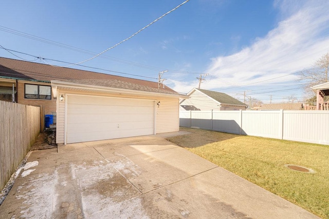 garage featuring a lawn